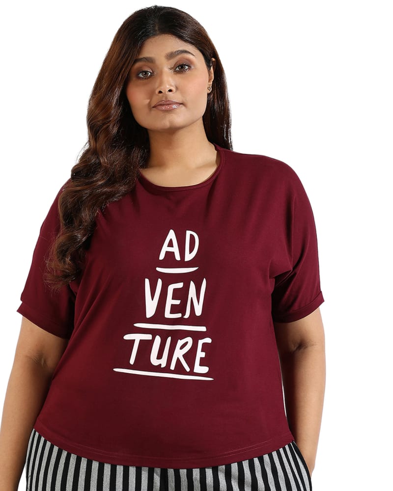 Front of a model wearing a size 5XL Women Graphic Printed Top in Red by Instafab Plus. | dia_product_style_image_id:294351